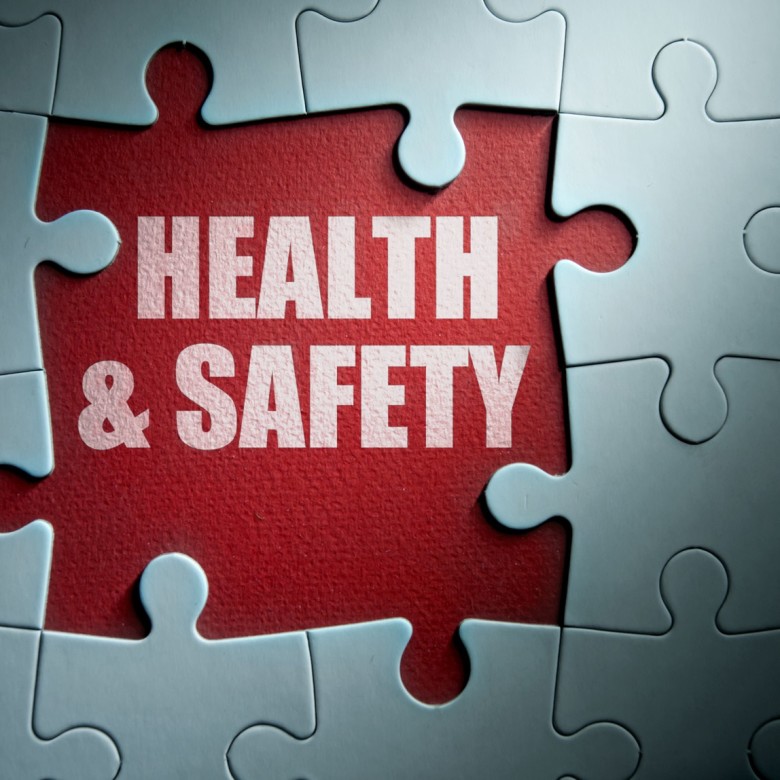 Missing pieces from a jigsaw puzzle revealing health and safety